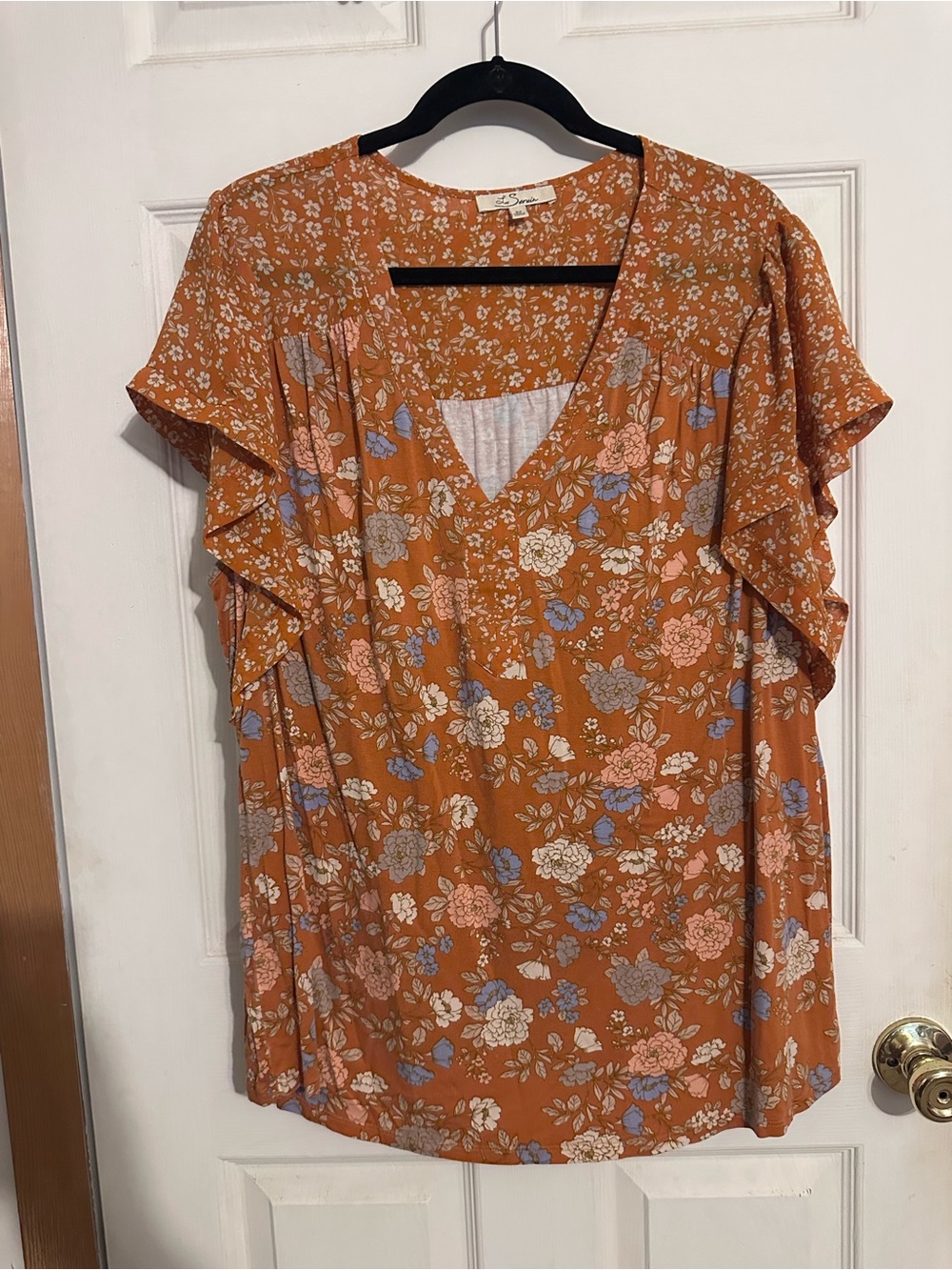 Floral flutter sleeve top